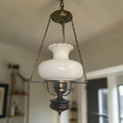 Classic mid-century modern milk glass pendant lamp, ready to brighten your home or vintage-inspired space.