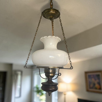Classic mid-century modern milk glass pendant lamp, ready to brighten your home or vintage-inspired space.
