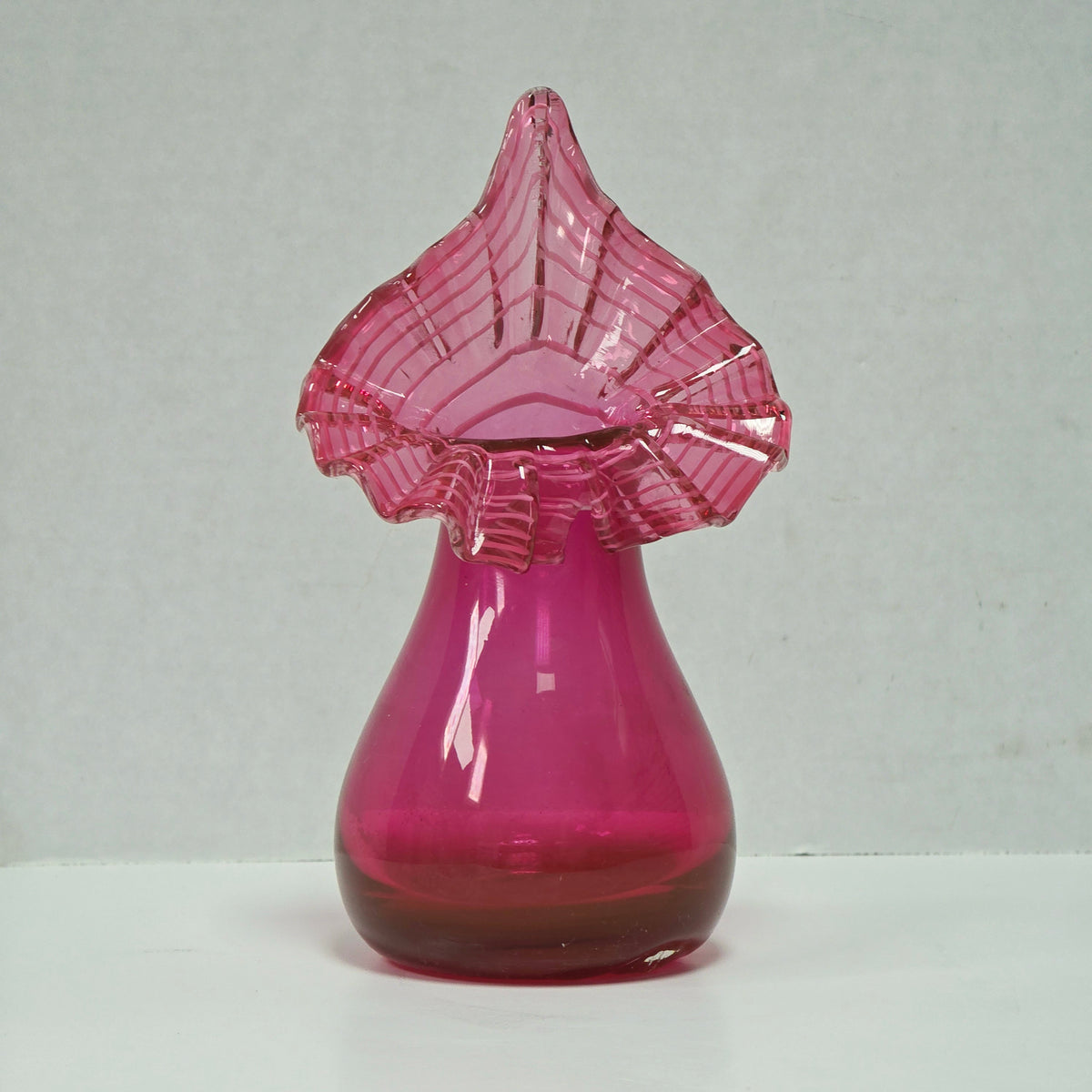 Vintage ruffled Jack-in-the-pulpit vase with white appliqué lace rim
