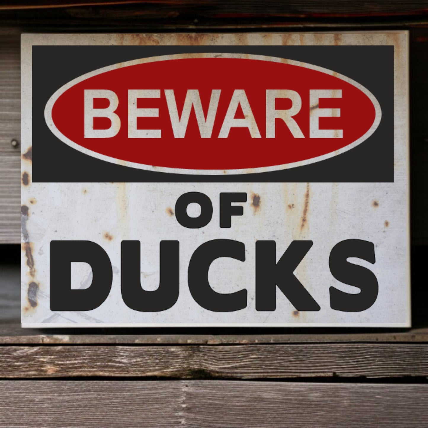 Rustic 'Beware of Ducks' sign on a wooden surface
