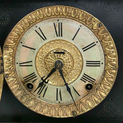 Antique E. Ingraham mantel clock with marbleized columns and bell strike movement.
