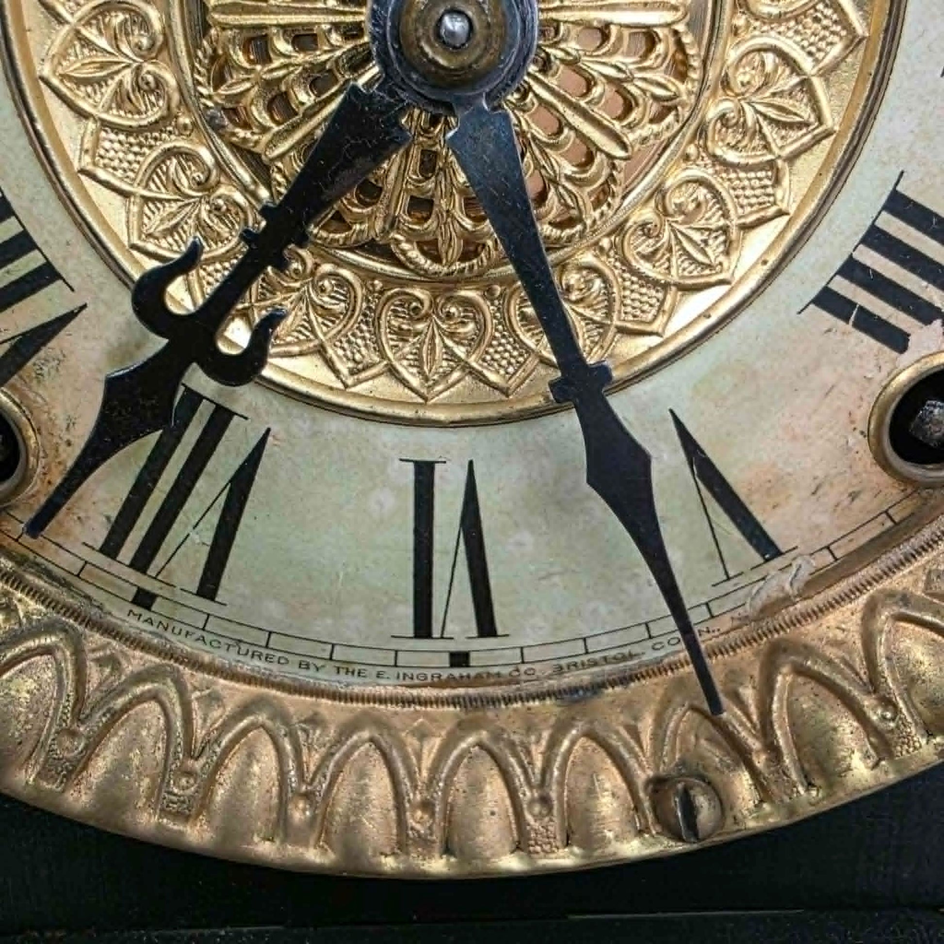 Antique E. Ingraham mantel clock with marbleized columns and bell strike movement.
