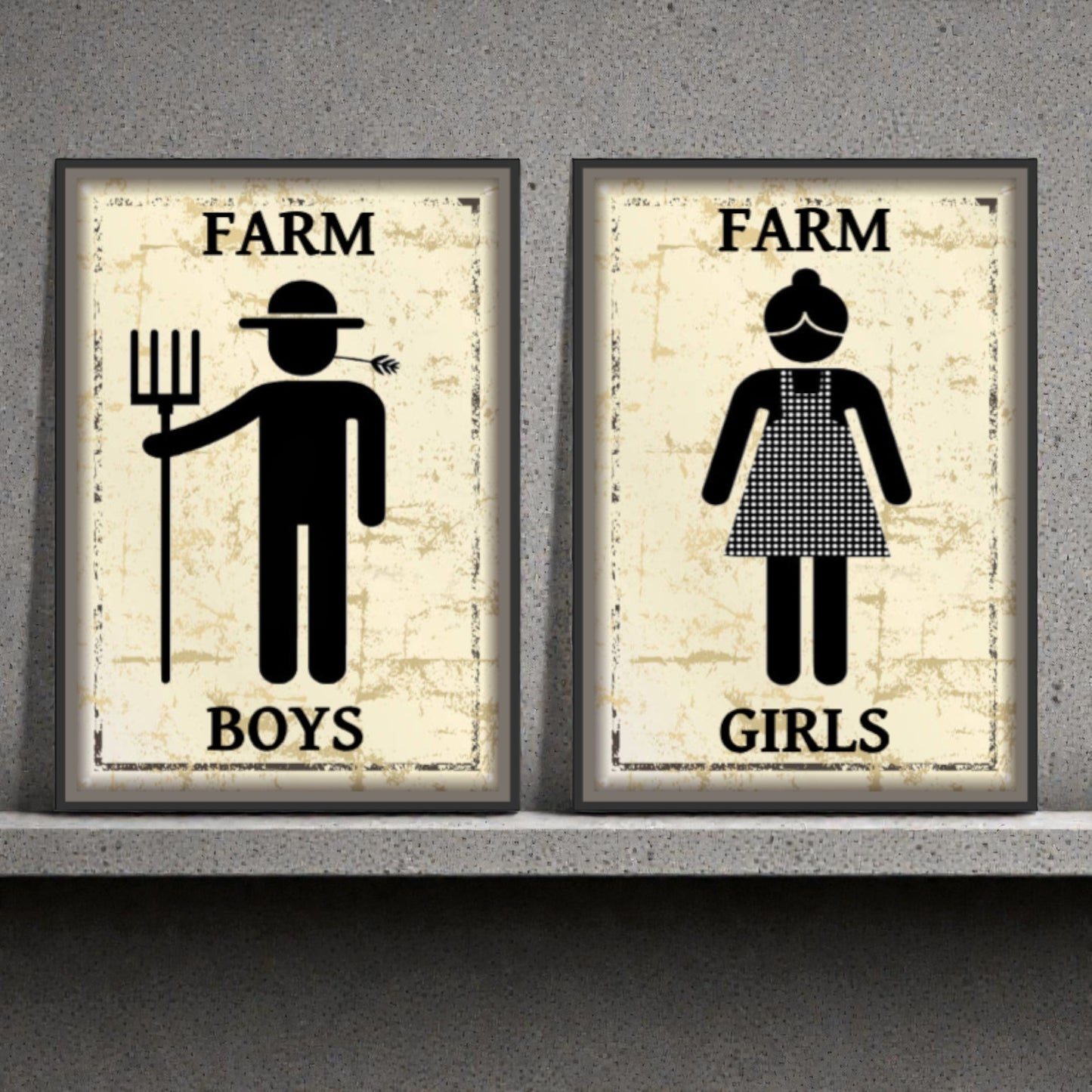Two framed posters labeled 'Farm Boys' and 'Farm Girls' on a concrete wall.