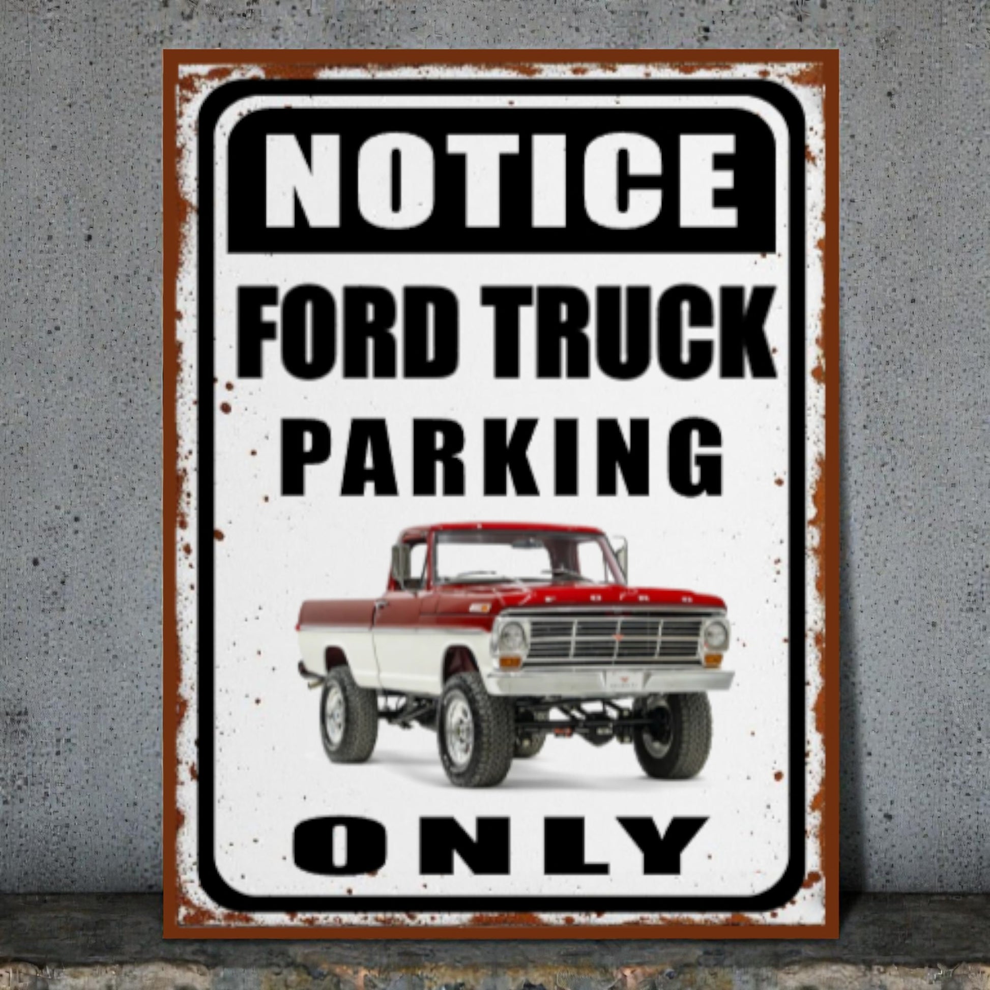 Metal sign with a red and white Ford truck and text 'Notice Ford Truck Parking Only' on a concrete wall.