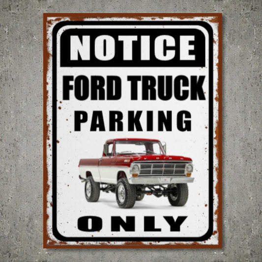 Metal sign with a red and white Ford truck and text 'Notice Ford Truck Parking Only' on a gray background.