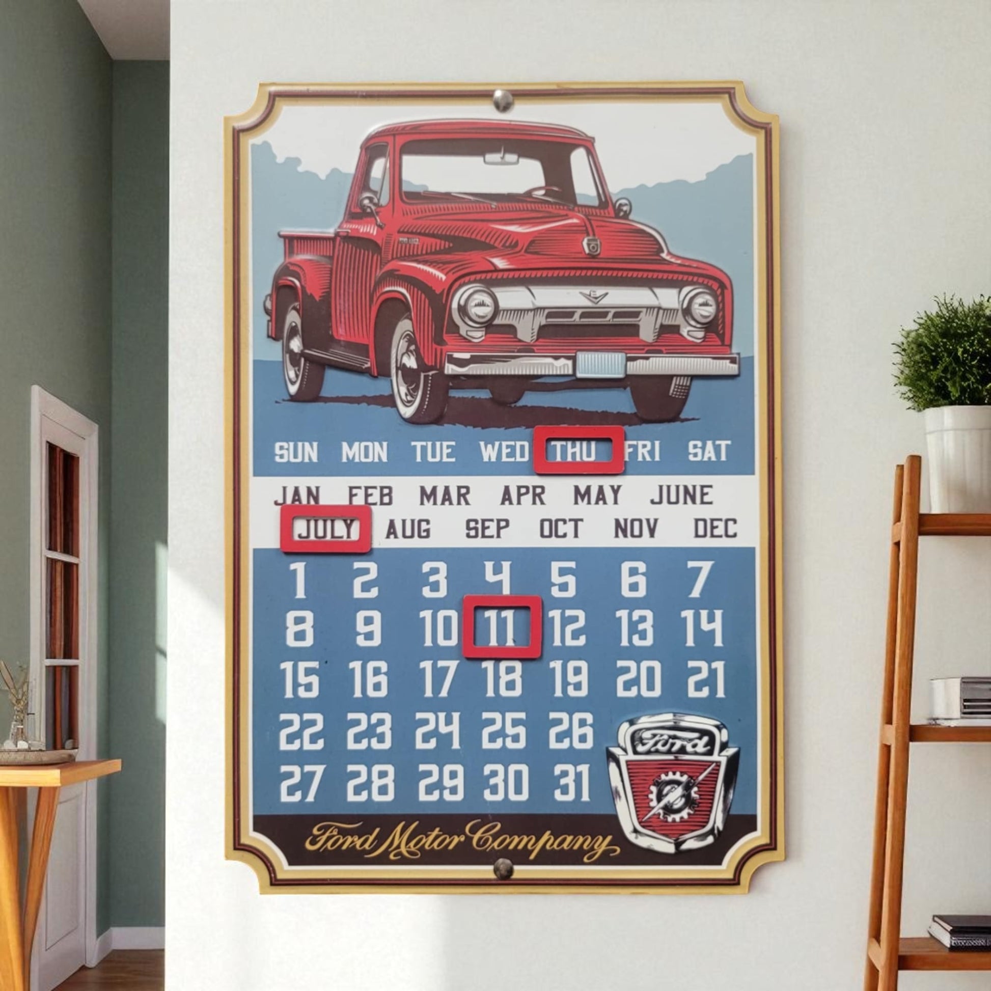 Vintage-style calendar with a red truck design on a wall.