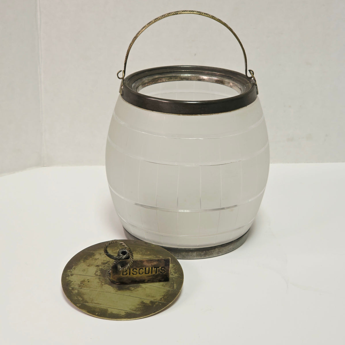 Victorian frosted glass biscuit barrel shaped like a wooden keg with silver accents
