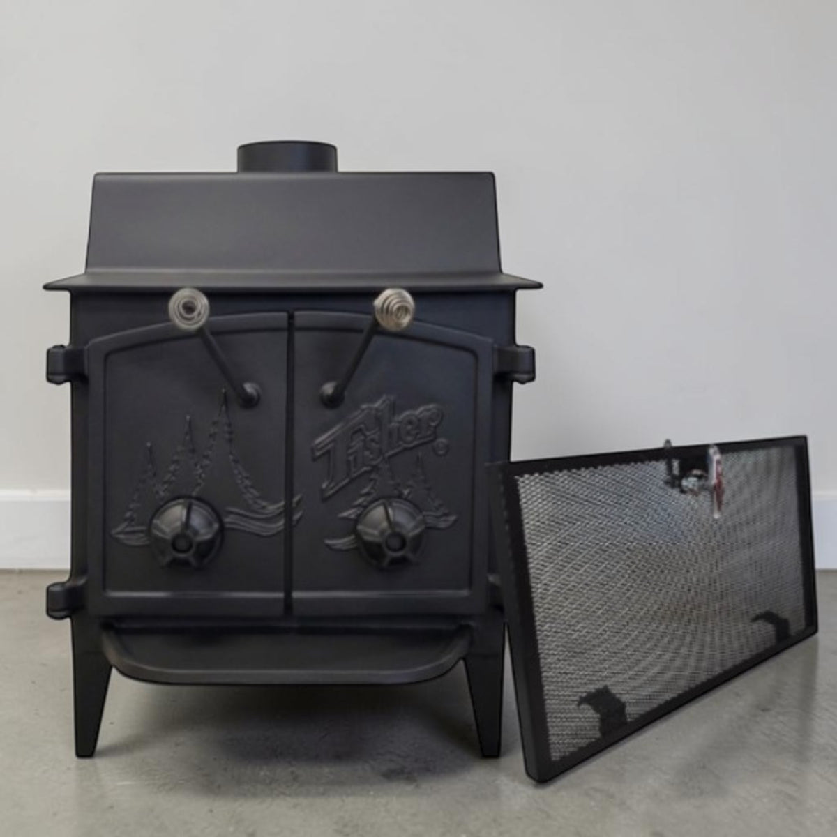 Fisher Grandma Bear wood stove with cathedral doors for dependable wood heating and off-grid living.
