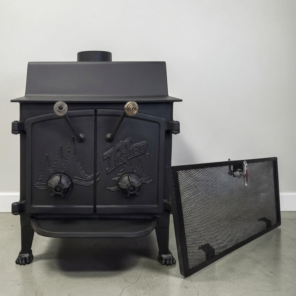 Fisher Grandma Bear wood stove with cathedral doors for dependable wood heating and off-grid living.
