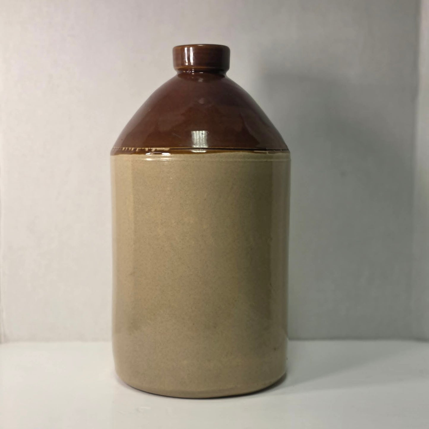Antique H. Dickson Albany merchant crock with hat shop advertising graphic.