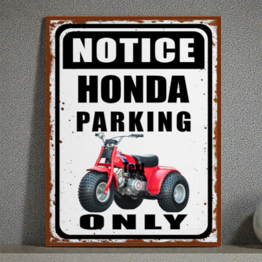Metal sign with red ATV graphic and text 'Notice Honda Parking Only' on a gray background