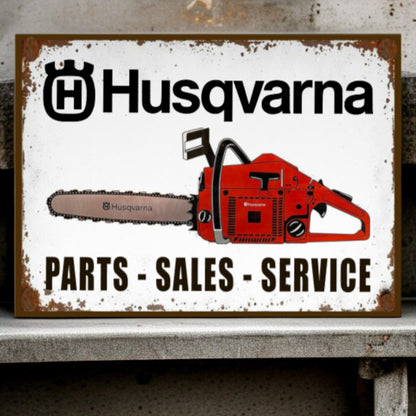 Husqvarna sign with a chainsaw graphic on a white background
