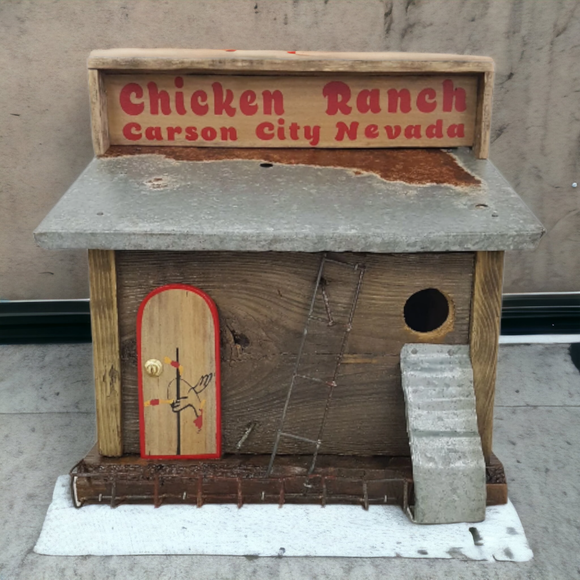 Handmade rustic Chicken Ranch folk art birdhouse made from reclaimed materials with chicken-themed artwork.
