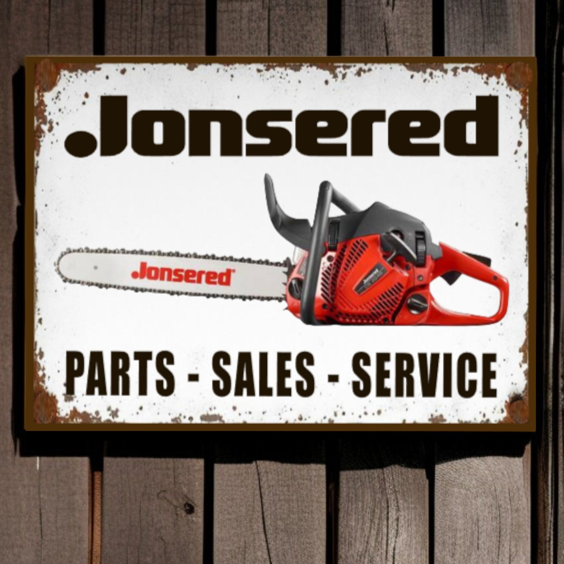 Jonsered chainsaw sign with text 'Parts - Sales - Service' on a wooden background