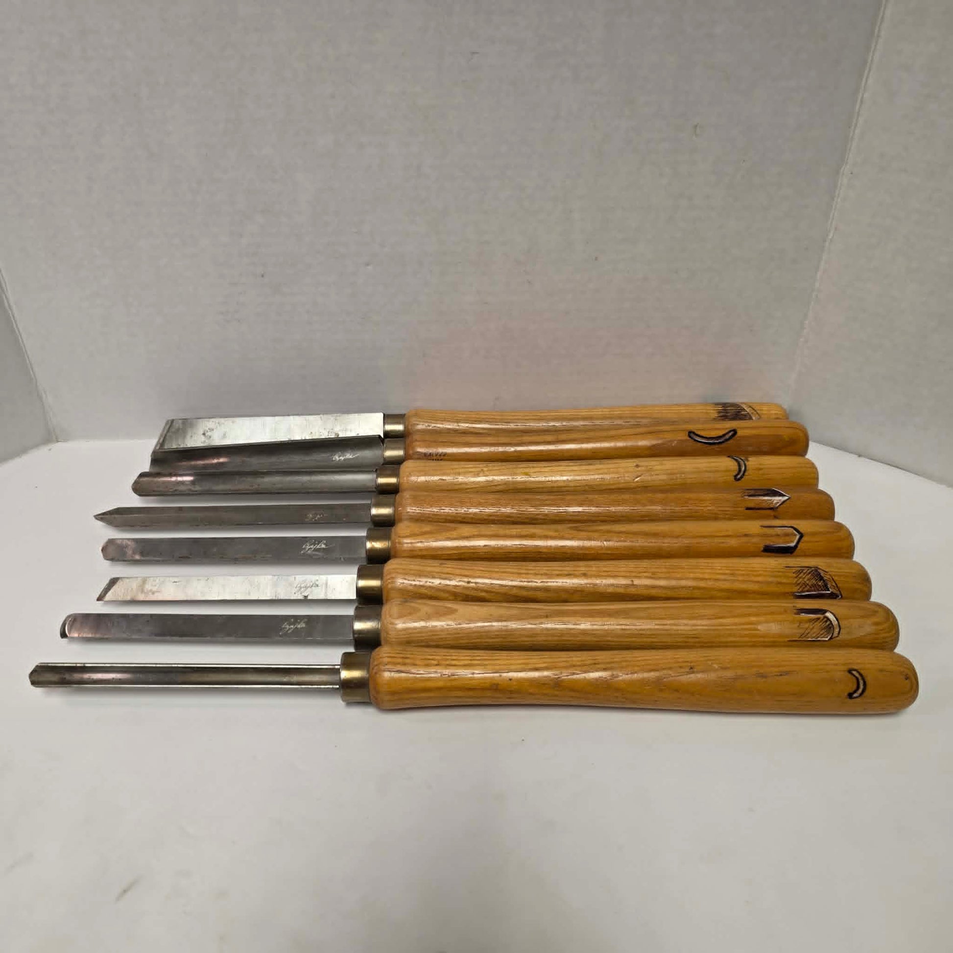 A rare signed set of eight Józef Gajka European woodturning chisels showcasing traditional Polish toolmaking craftsmanship.