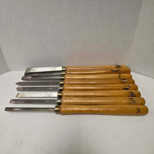 A rare signed set of eight Józef Gajka European woodturning chisels showcasing traditional Polish toolmaking craftsmanship.