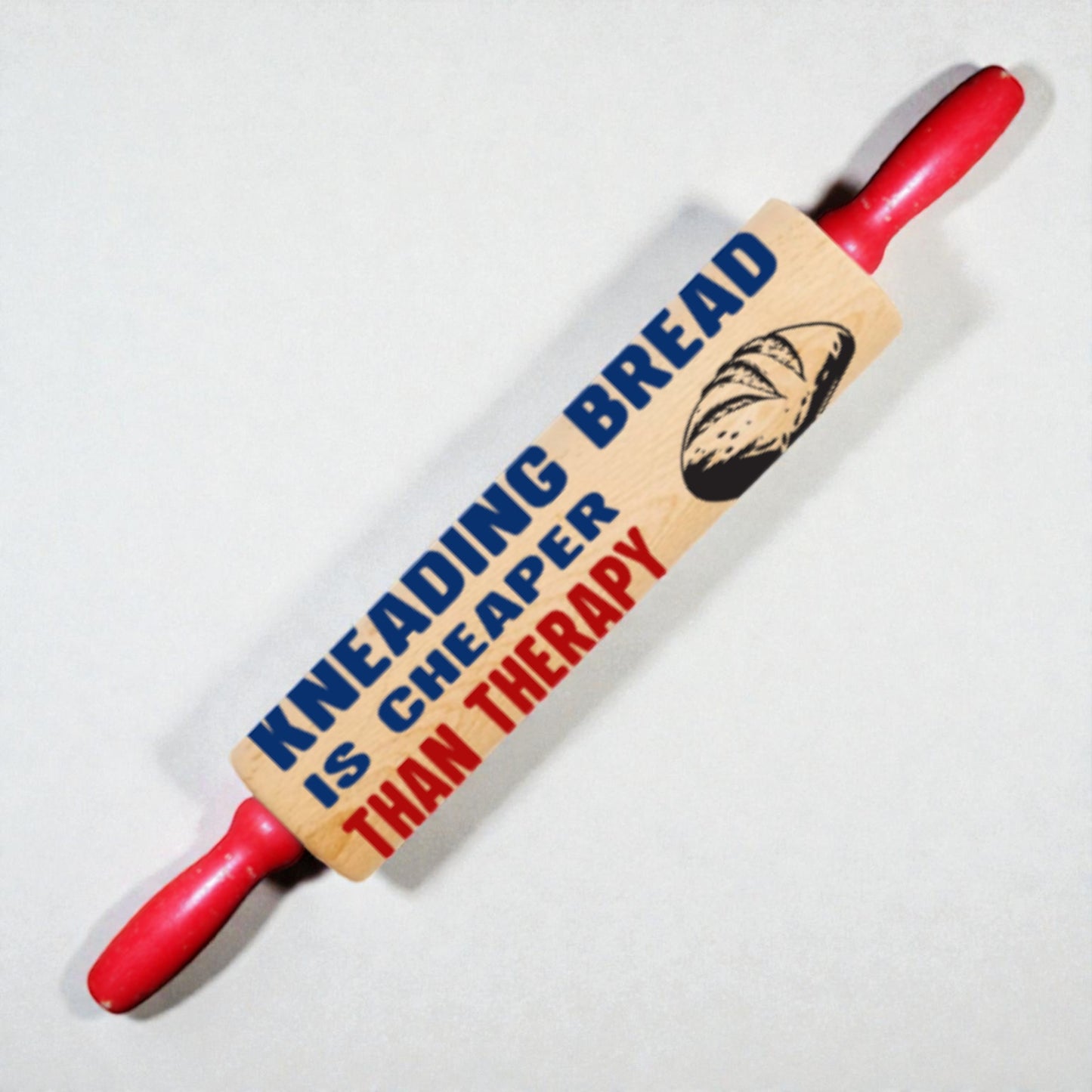 Rolling pin with humorous text and bread illustration on a white background