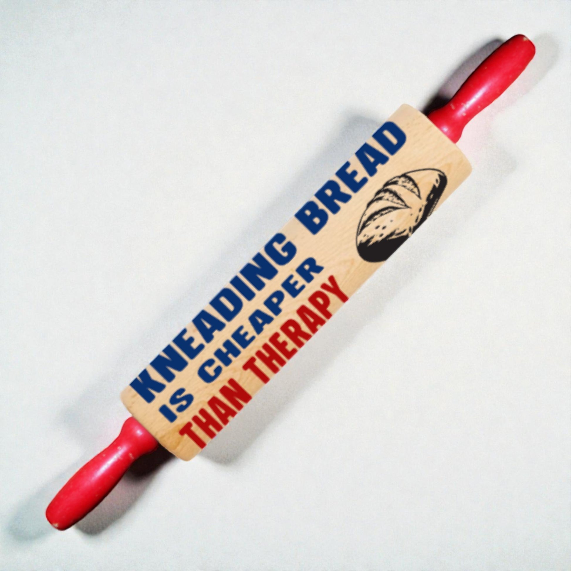 Rolling pin with a humorous message on a white background