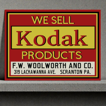 Vintage sign advertising Kodak products sold at F.W. Woolworth and Co.