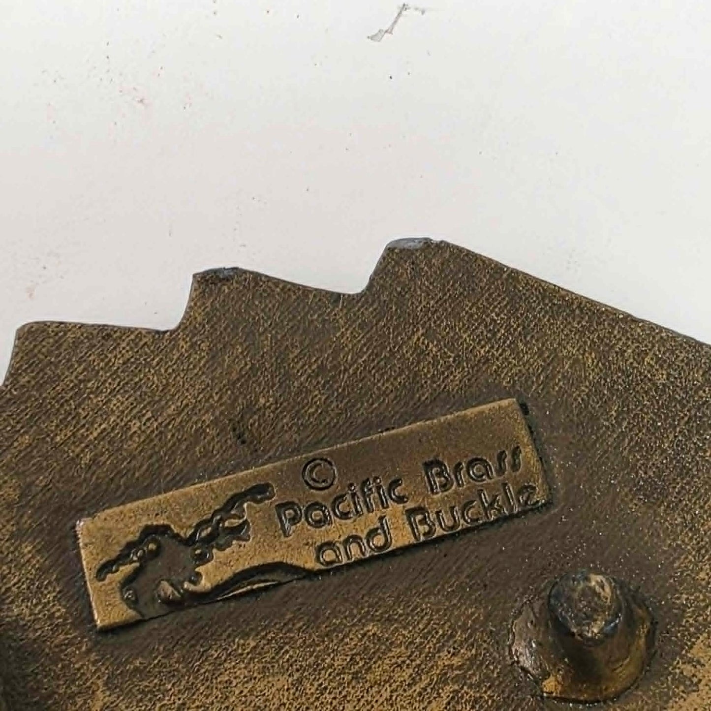 Vintage brass Las Vegas Nevada belt buckle featuring a straight flush poker hand by Pacific Brass and Buckle Co.
