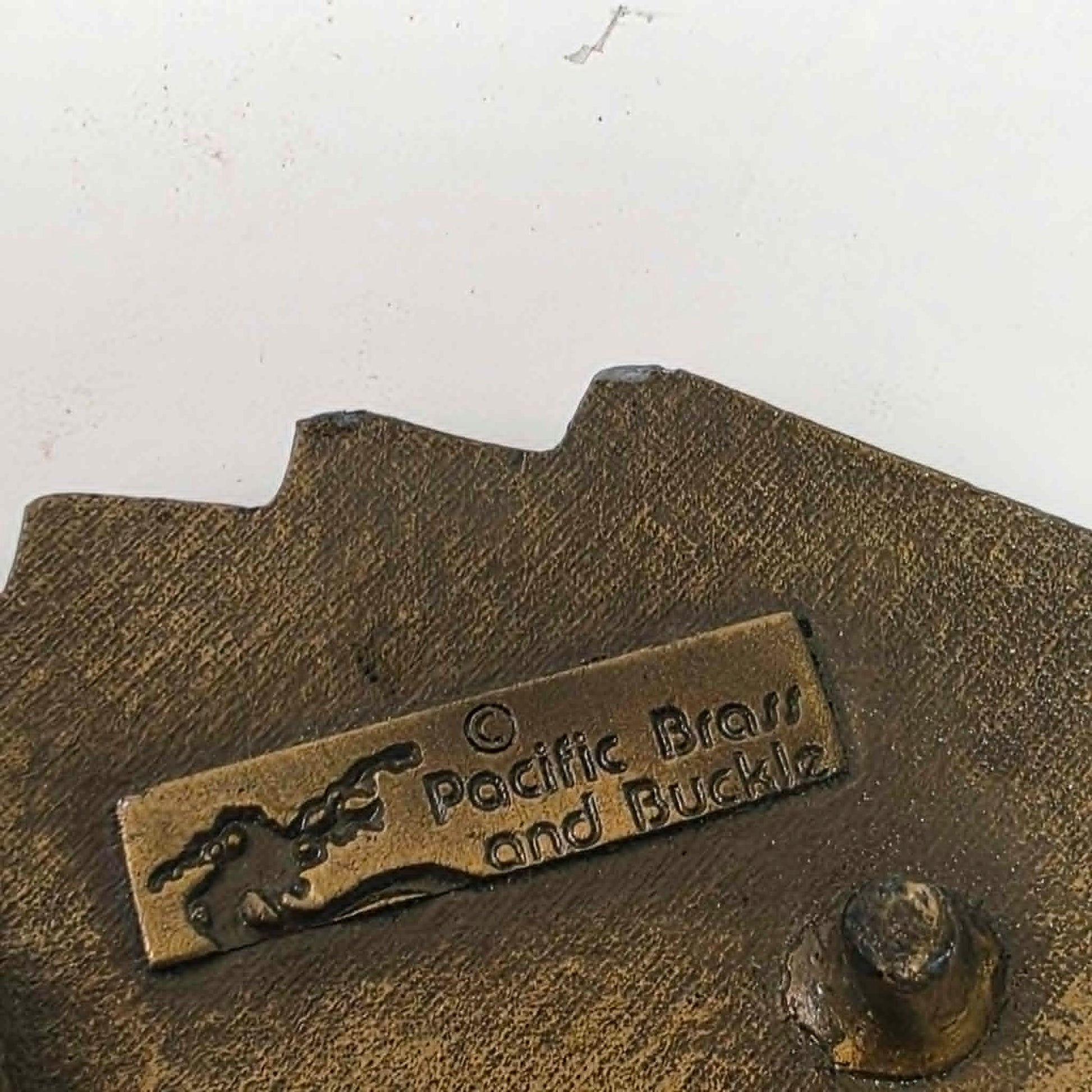 Vintage brass Las Vegas Nevada belt buckle featuring a straight flush poker hand by Pacific Brass and Buckle Co.
