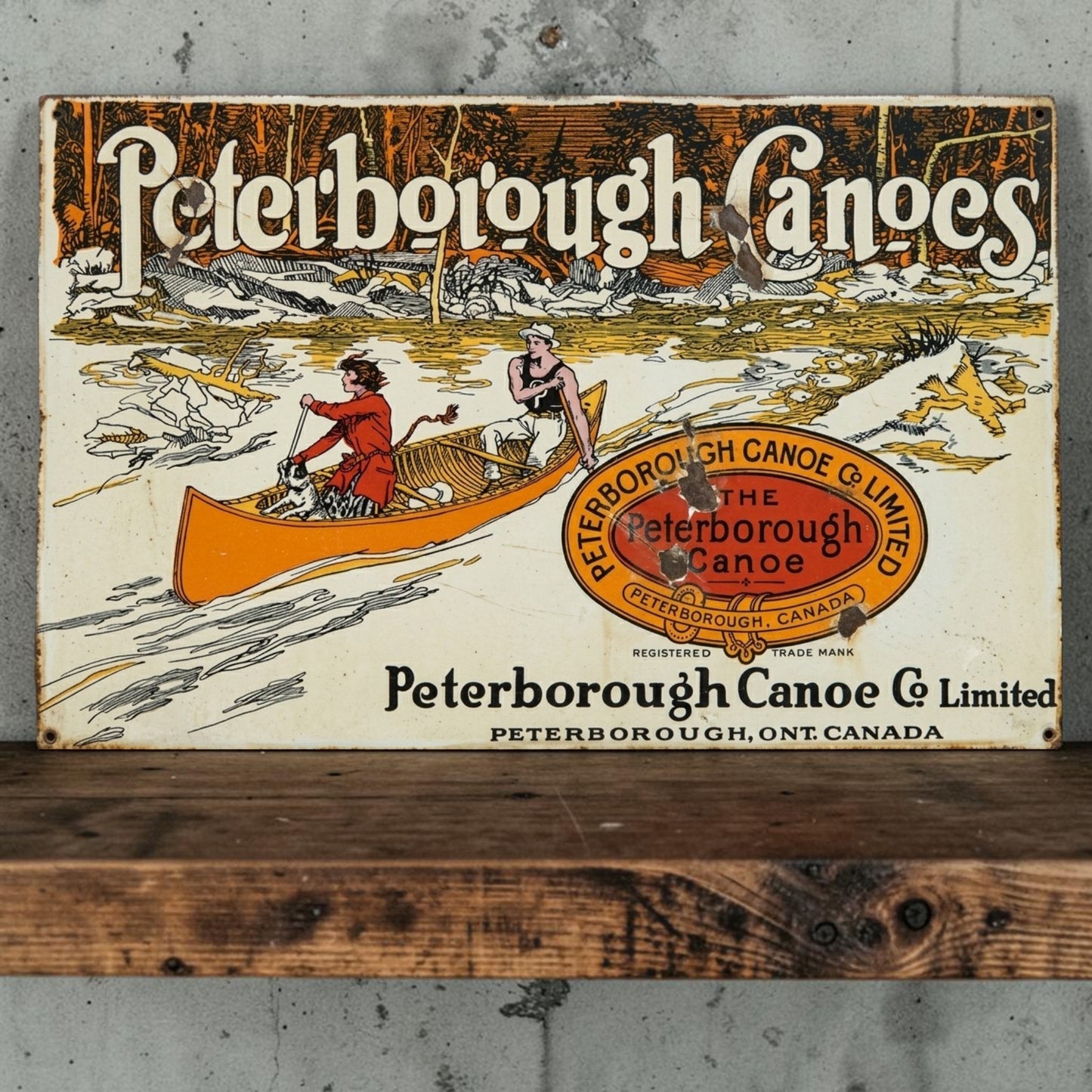 Rustic Peterborough Canoes Co. Limited aluminum sign featuring Peterborough Ontario Canada canoe company décor.

