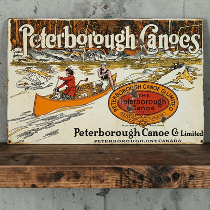 Rustic Peterborough Canoes Co. Limited aluminum sign featuring Peterborough Ontario Canada canoe company décor.

