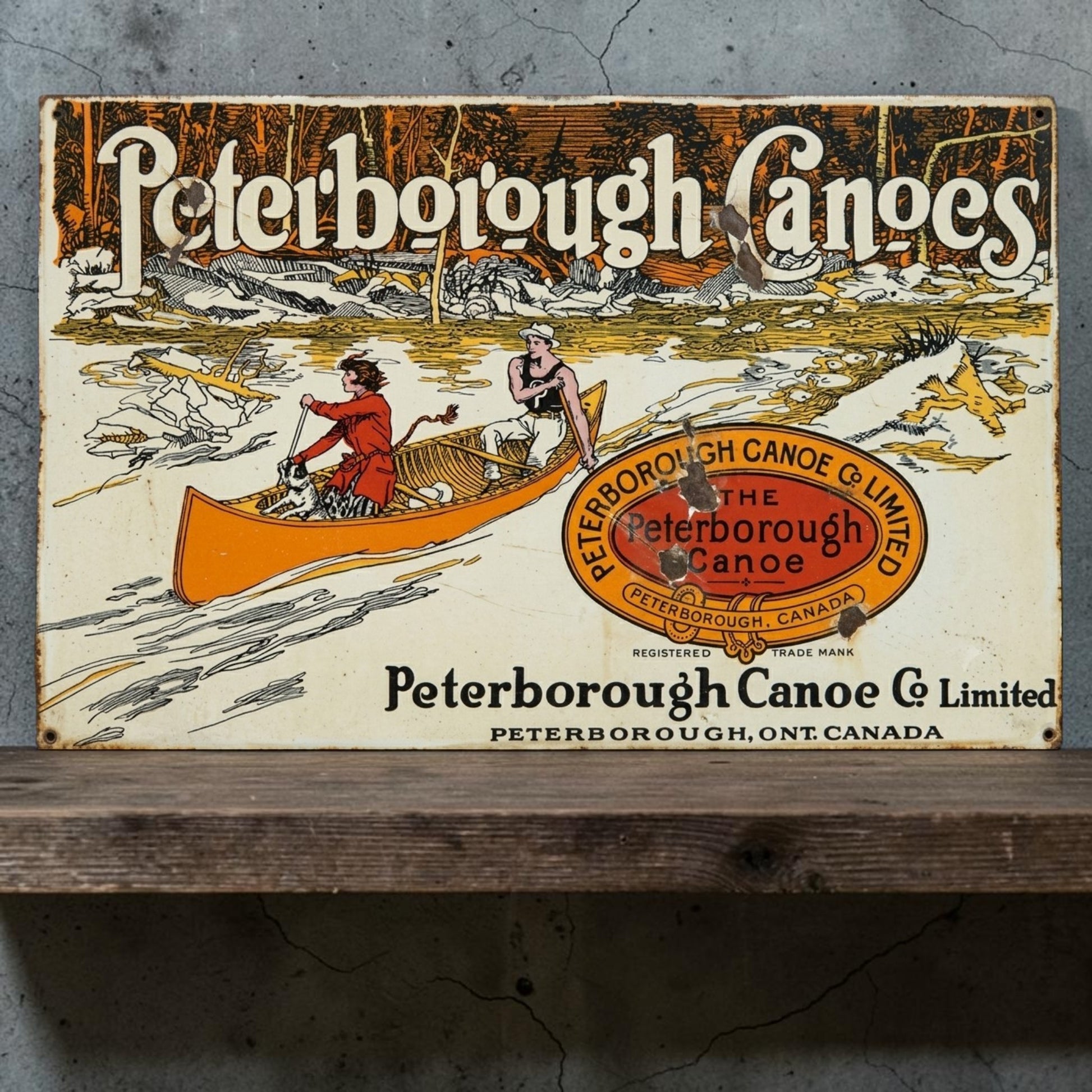 Rustic Peterborough Canoes Co. Limited aluminum sign featuring Peterborough Ontario Canada canoe company décor.
