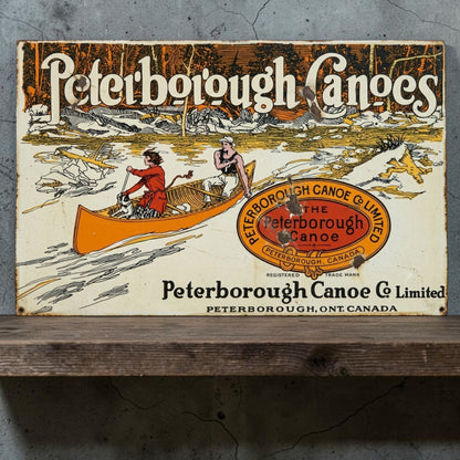 Rustic Peterborough Canoes Co. Limited aluminum sign featuring Peterborough Ontario Canada canoe company décor.
