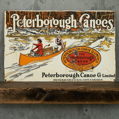 Rustic Peterborough Canoes Co. Limited aluminum sign featuring Peterborough Ontario Canada canoe company décor.
