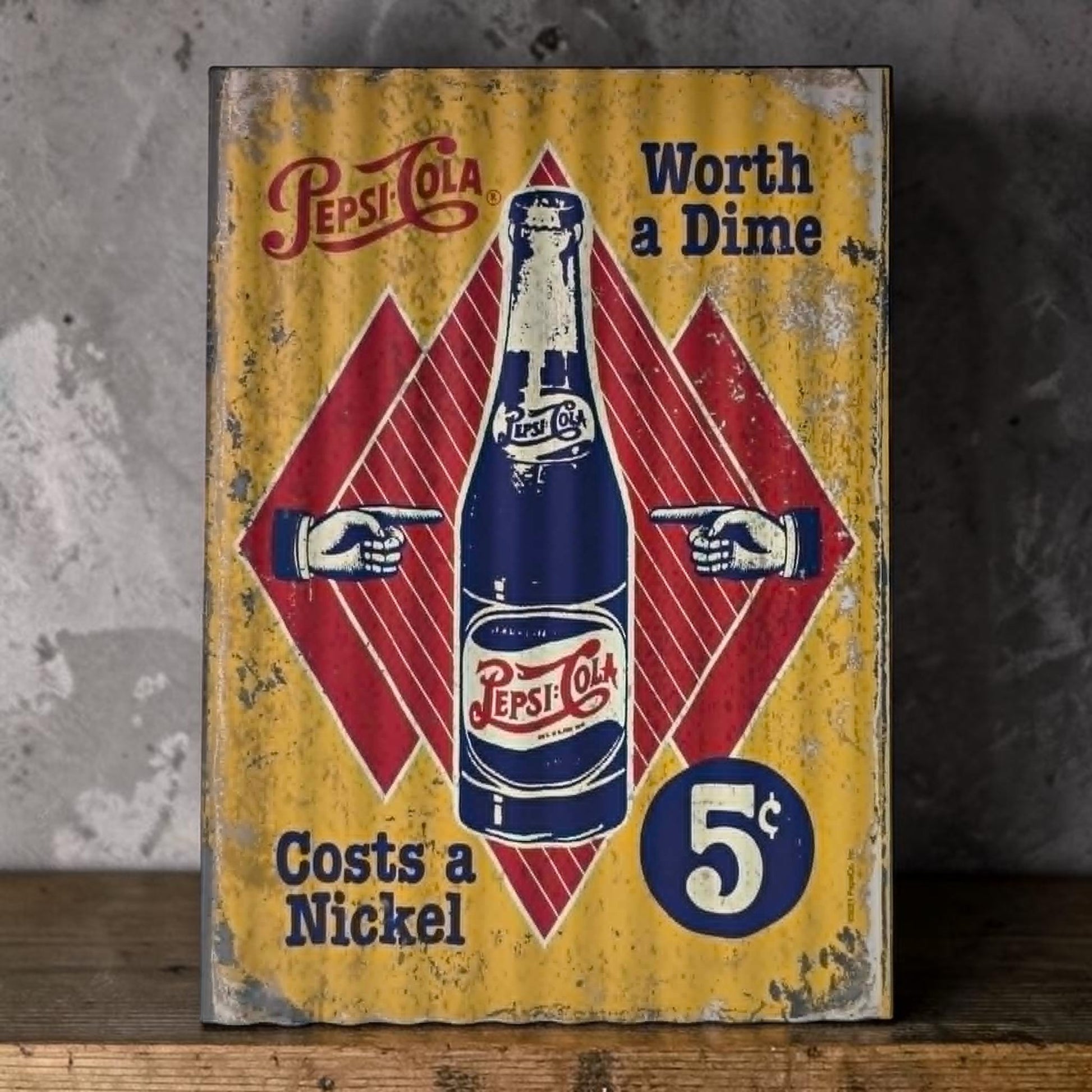 Retro Pepsi-Cola corrugated metal sign with Worth a Dime Costs a Nickel design.
