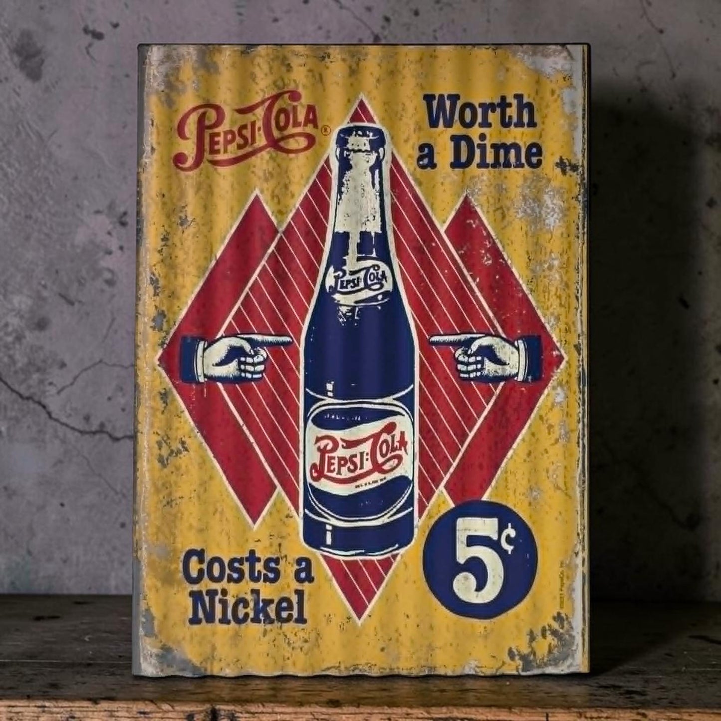 Retro Pepsi-Cola corrugated metal sign with Worth a Dime Costs a Nickel design.

