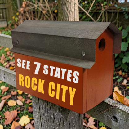Red reclaimed barn tin Rock City double birdhouse with “See 7 States” hand lettering and two nesting compartments.