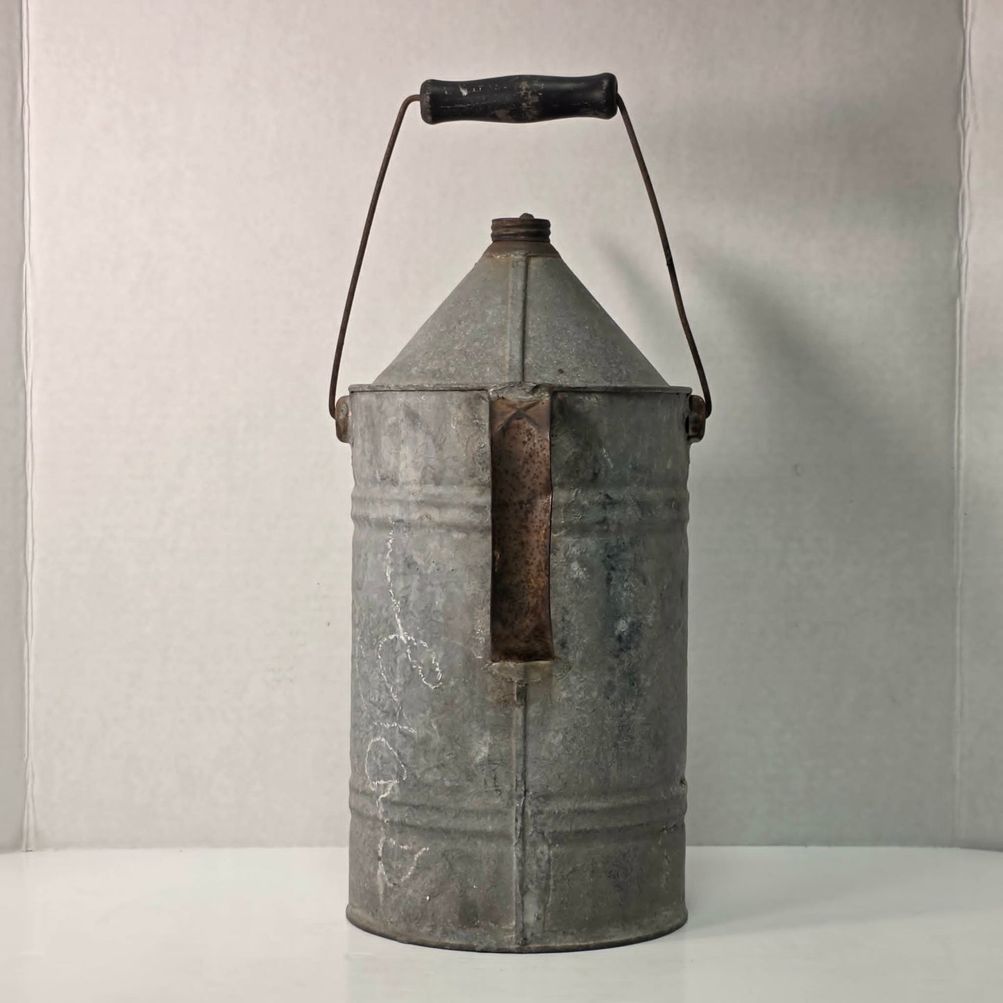 Antique galvanized oil can with classic railroad-inspired industrial character.