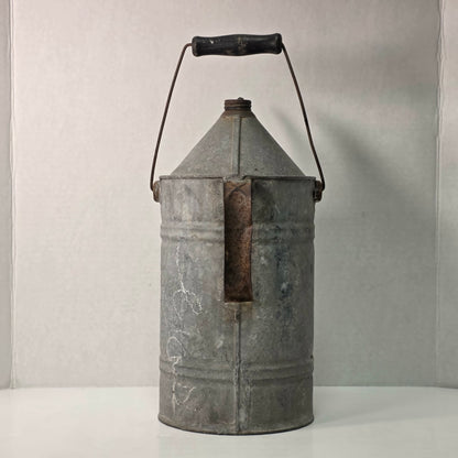 Antique galvanized oil can with classic railroad-inspired industrial character.
