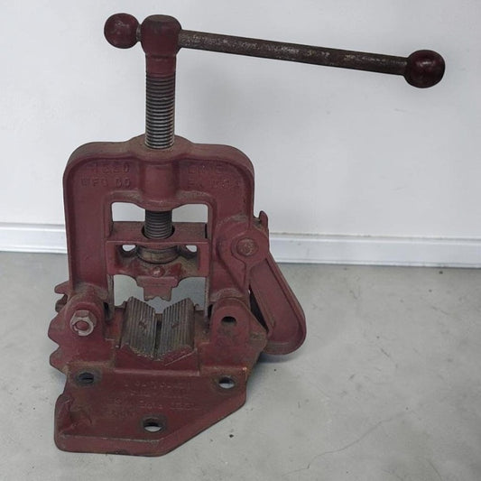 Vintage Reed No. 1 portable pipe vise for plumbing and workshop use.
