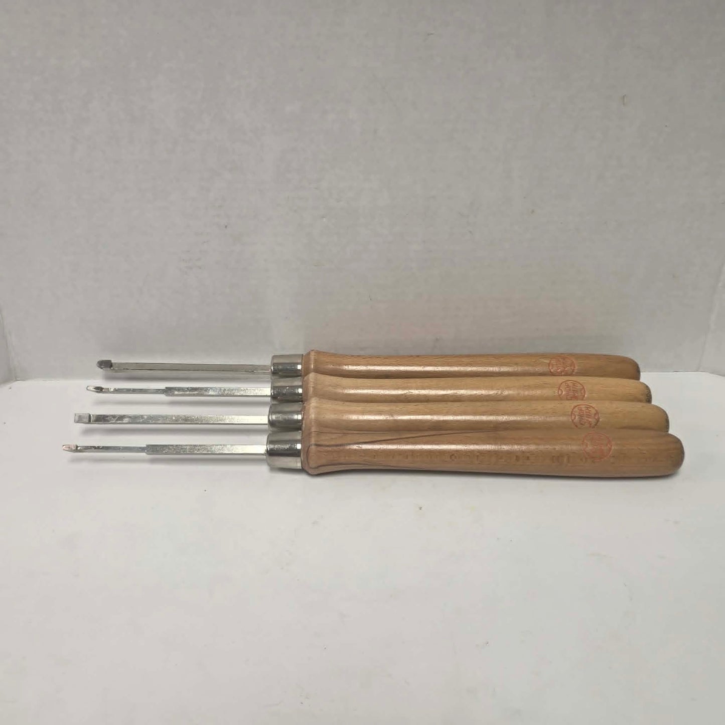 A rare vintage ShopSmith woodturning chisel set in excellent condition, featuring four specialty turning tools.