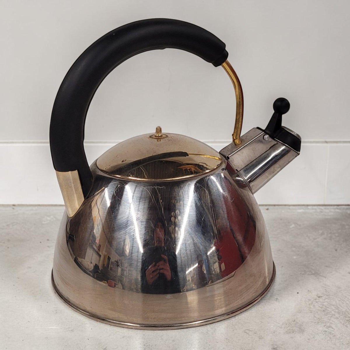 Vintage Josef Strauss Symphony stainless steel whistling tea kettle with mid-century modern design.
