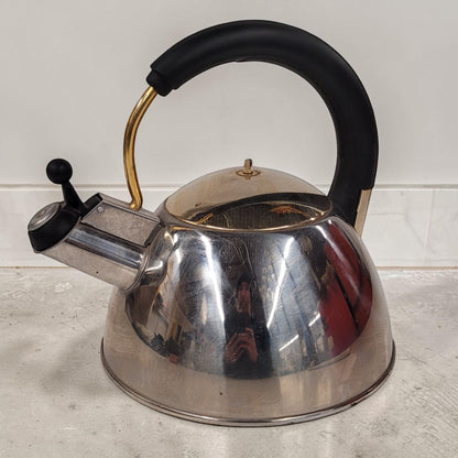 Vintage Josef Strauss Symphony stainless steel whistling tea kettle with mid-century modern design.
