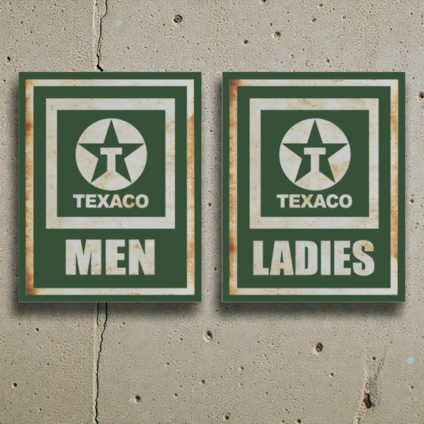 Two vintage-style Texaco restroom signs on a concrete wall.