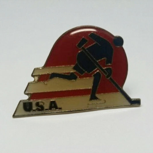 Pin with a silhouette of a person pushing a sled, set against a red circle on a white background.