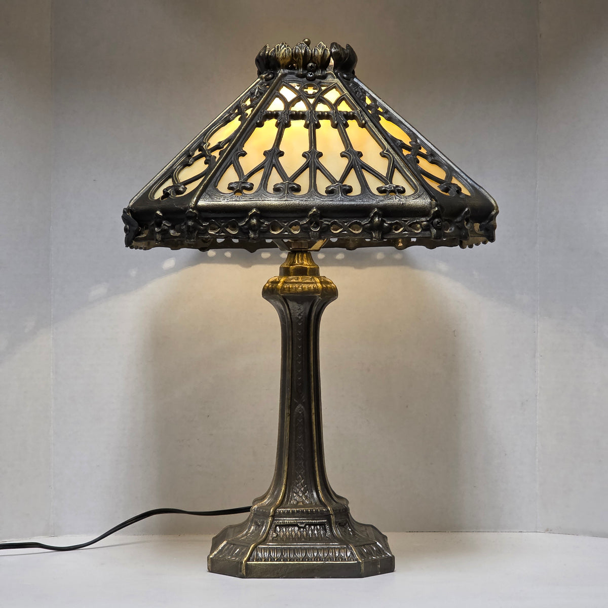Timeless Victorian elegance in bronze and slag glass.