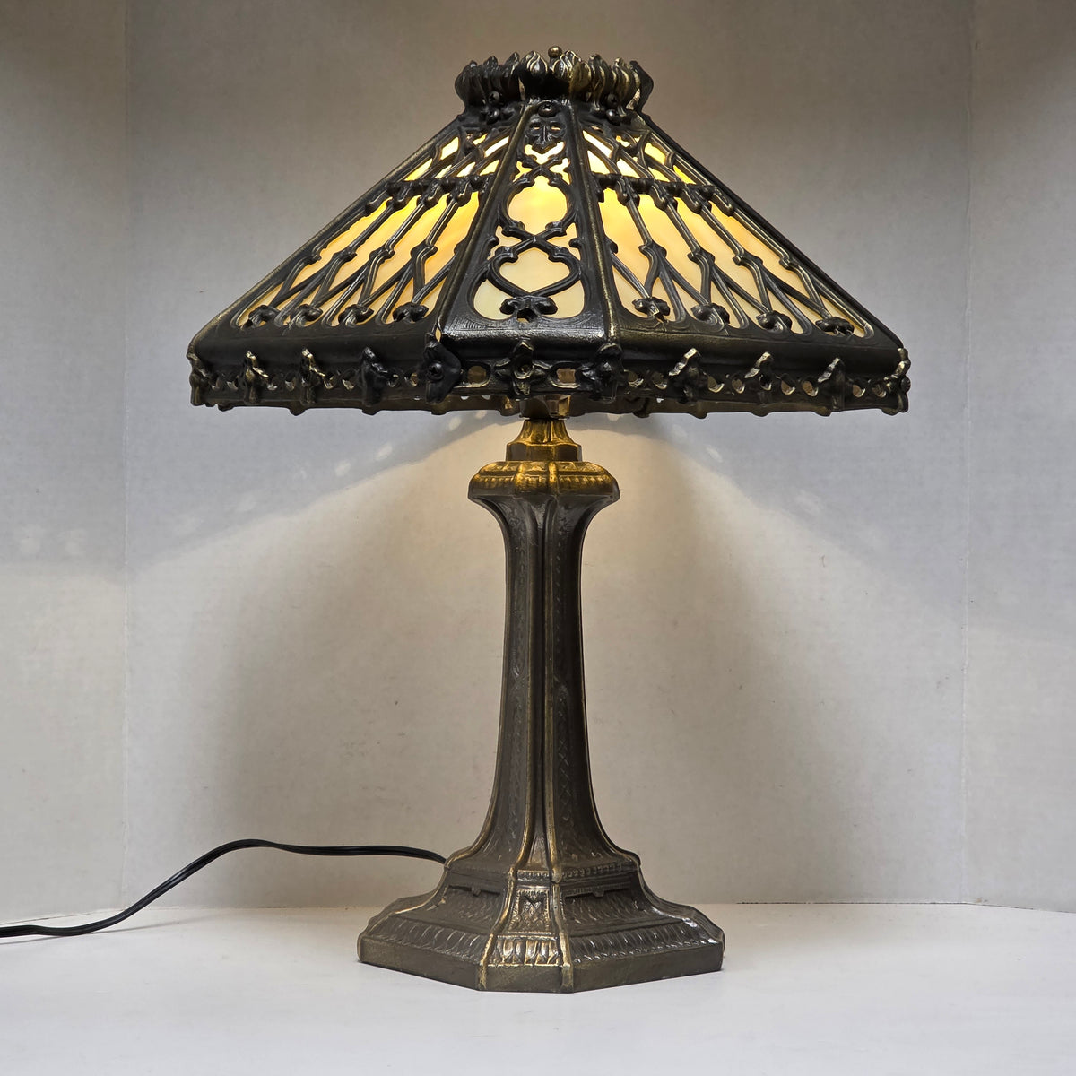Timeless Victorian elegance in bronze and slag glass.