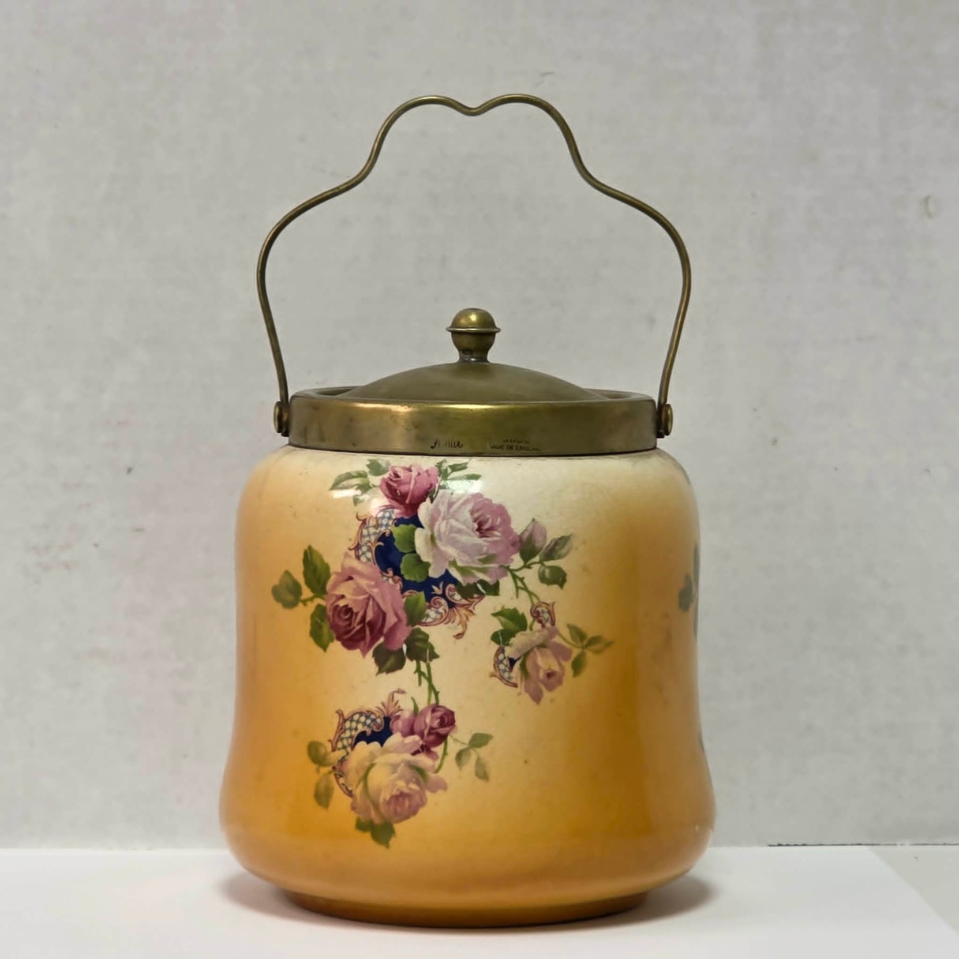 Victorian porcelain biscuit barrel with beautiful rose motif and antique crazing.
