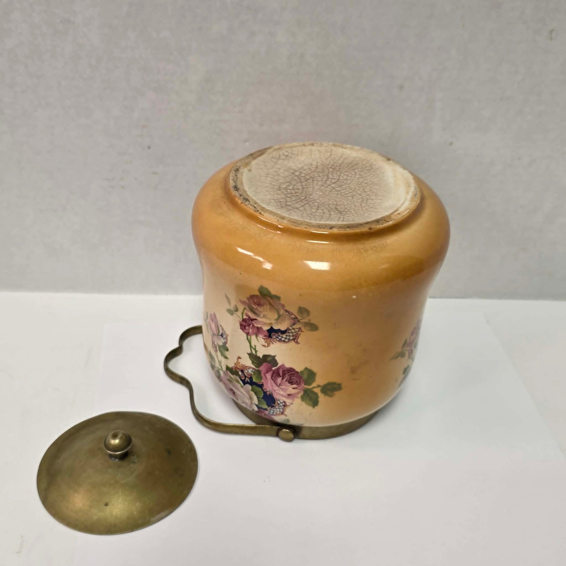 Victorian porcelain biscuit barrel with beautiful rose motif and antique crazing.
