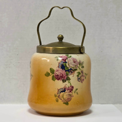 Victorian porcelain biscuit barrel with beautiful rose motif and antique crazing.
