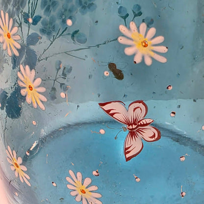 Victorian pastel blue glass biscuit barrel with hand-painted flowers, butterflies and bees.

