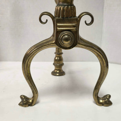 Victorian brass and bronze fireplace andirons with ornate figural bases and fluted ball finials.
