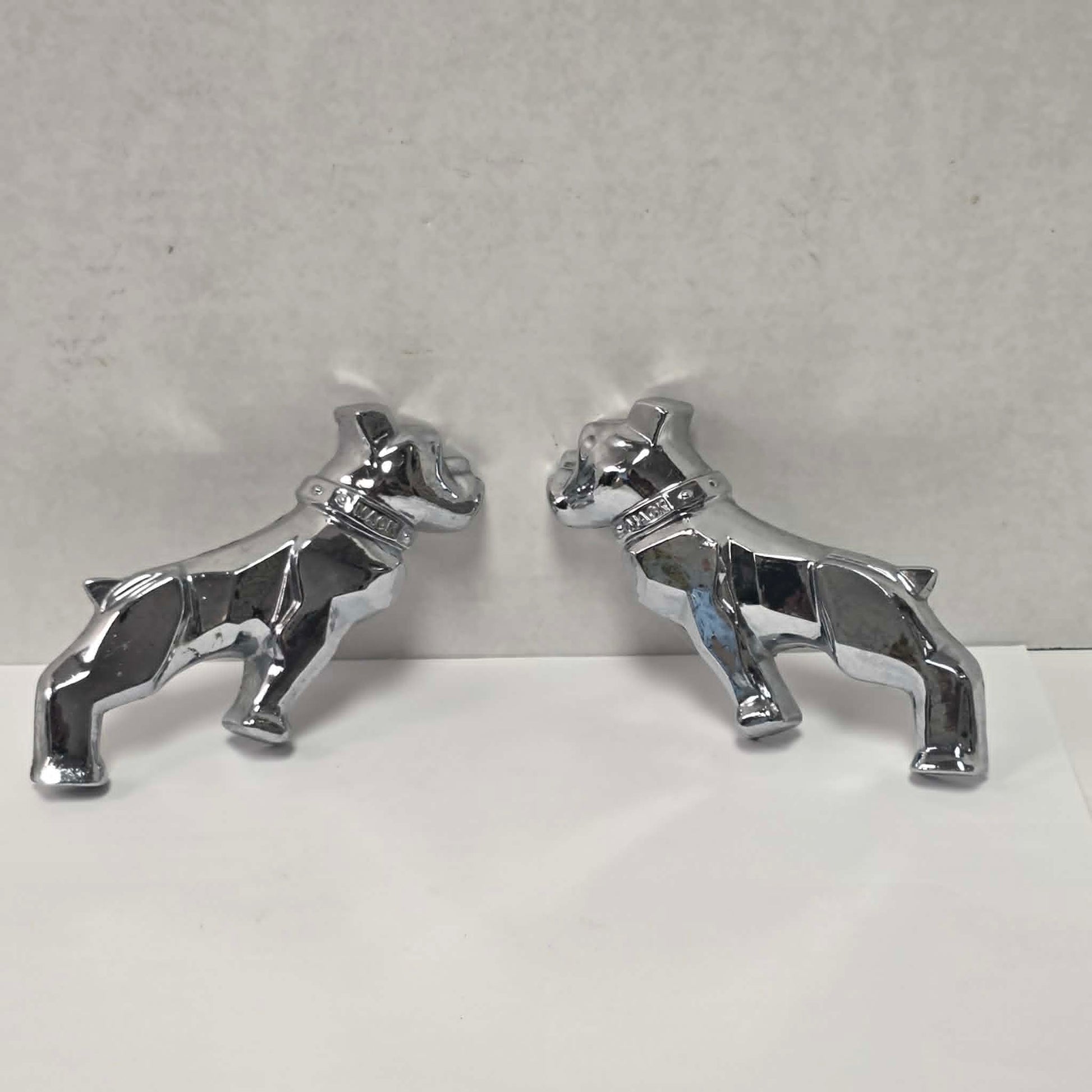 Pair of original vintage Mack truck chrome fender emblems in excellent used condition.
