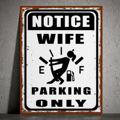 Metal sign with humorous design of a woman and text 'Notice Wife Parking Only' on a gray background
